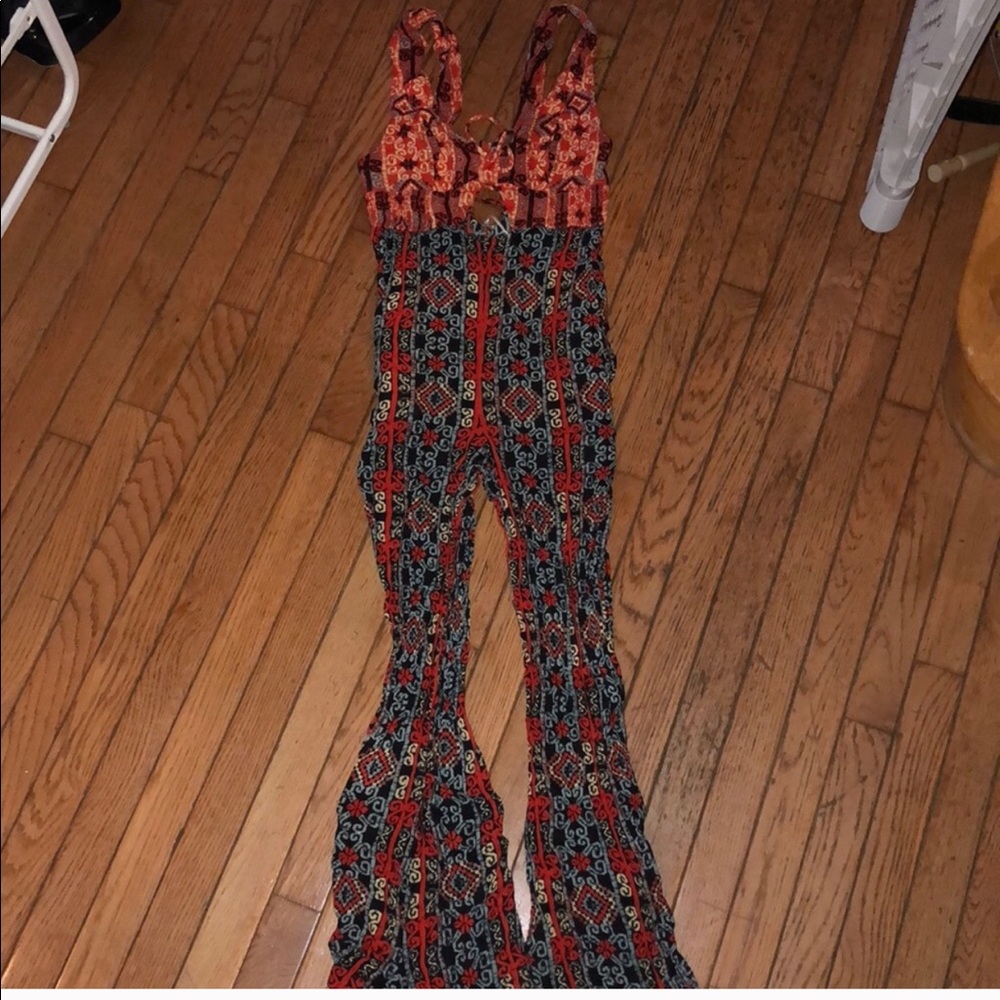 Reselling free people jumpsuit